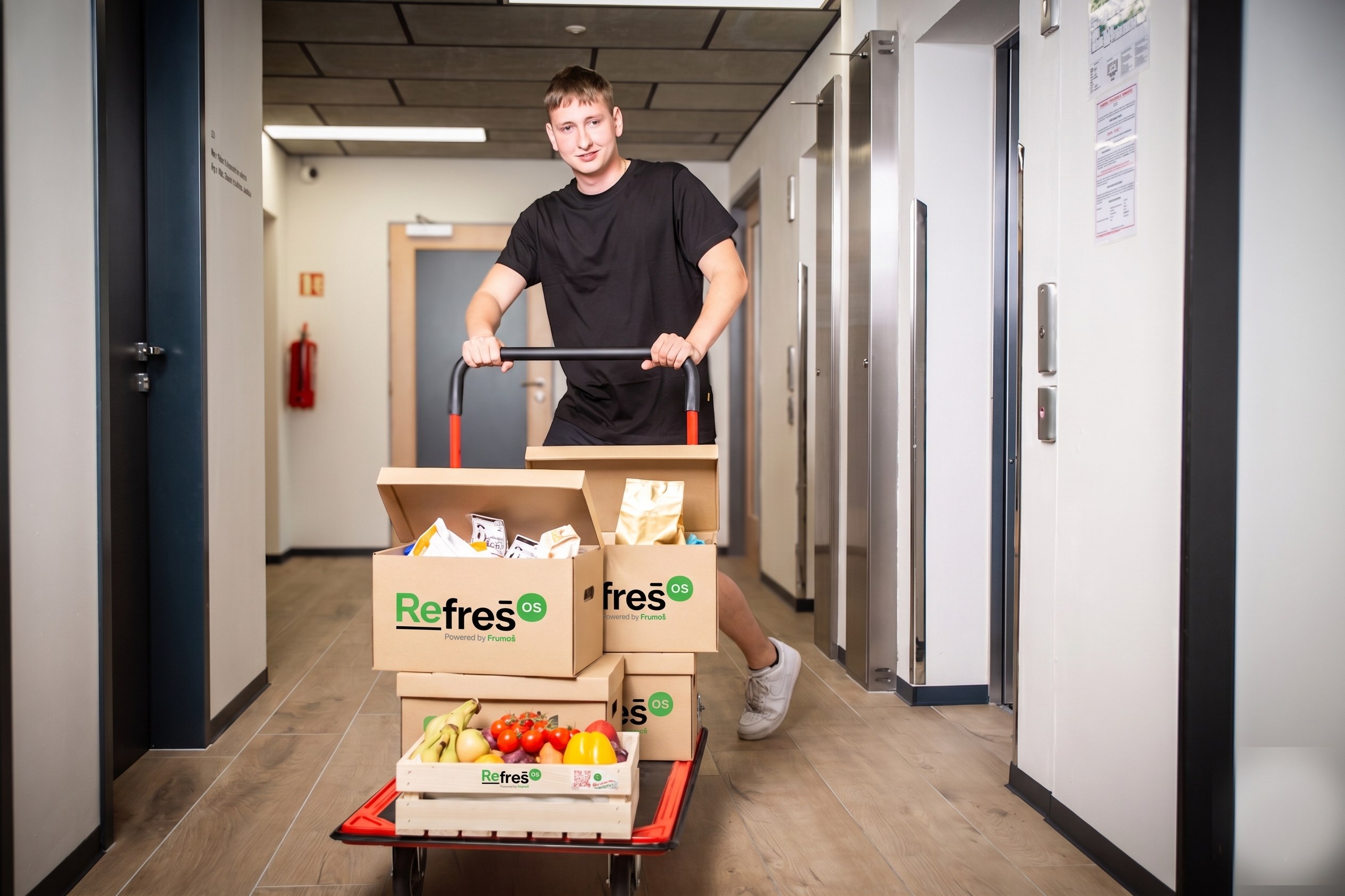 A RefrešOS agent restocking an office kitchen